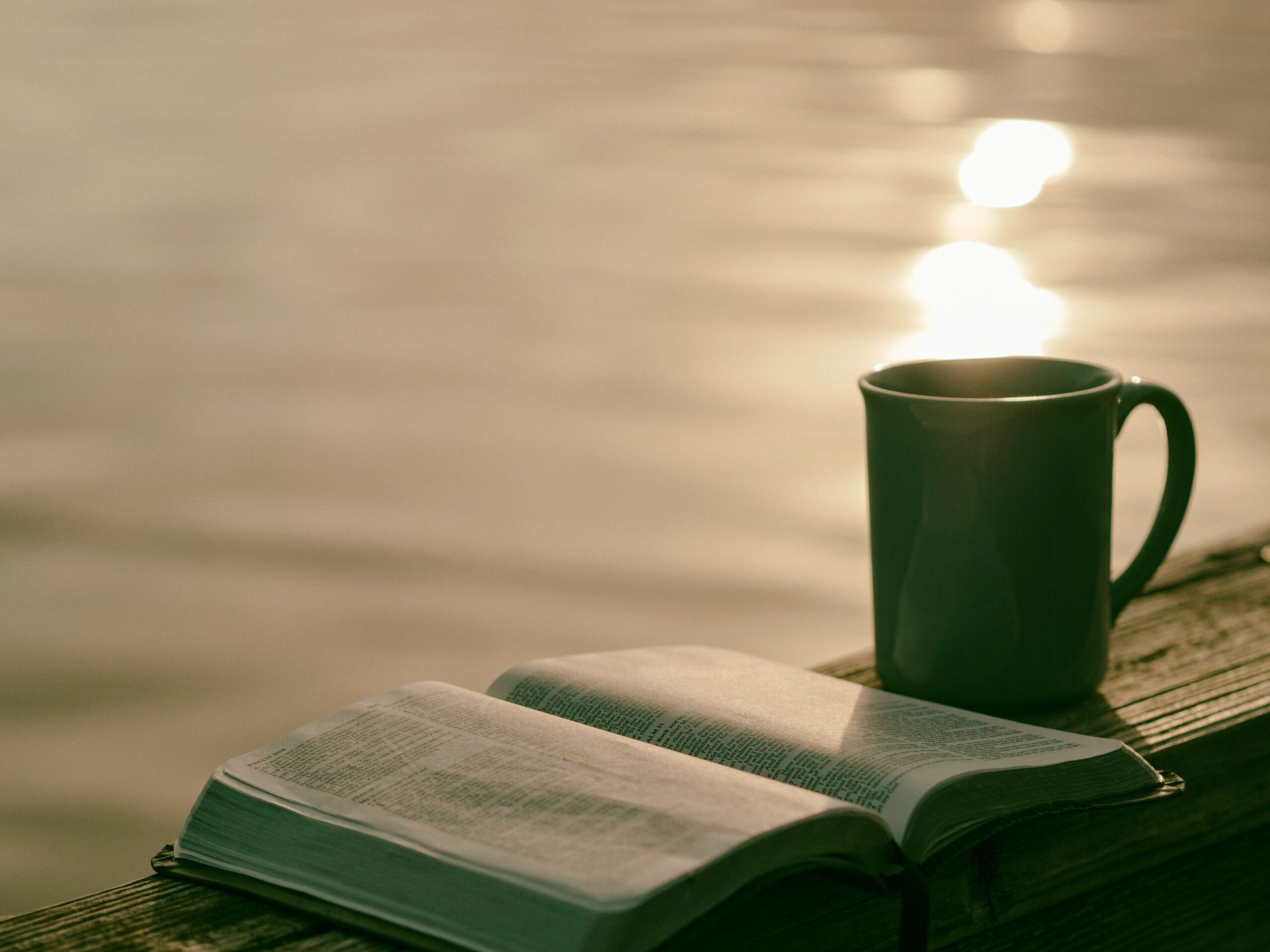 Open book beside a mug of tea, part of a calming evening wind-down routine