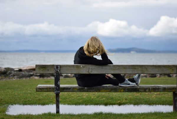 Woman in her 40s enjoying a balanced meal, representing perimenopause nutrition support for hormonal changes
