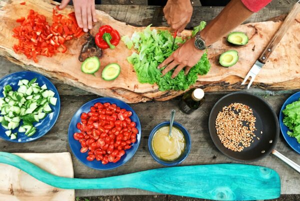 Woman preparing a calming, balanced meal, representing the connection between food and stress